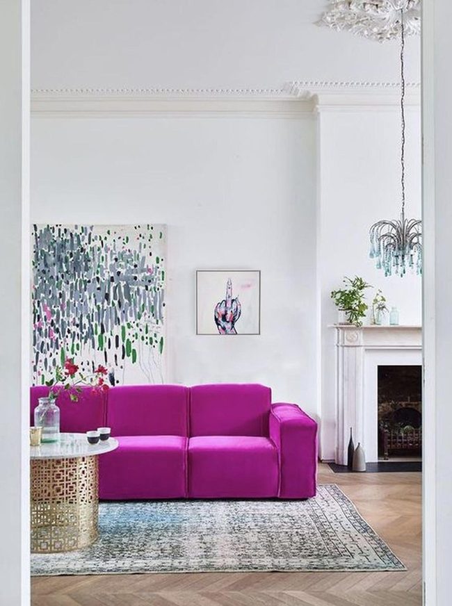 Purple Sofa Anchors Bright Minimalist Space