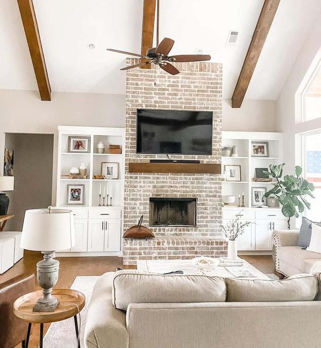 Exposed Wood Beams Meet Brick Fireplace