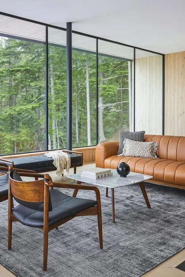 Floor-To-Ceiling Glass And Caramel Leather