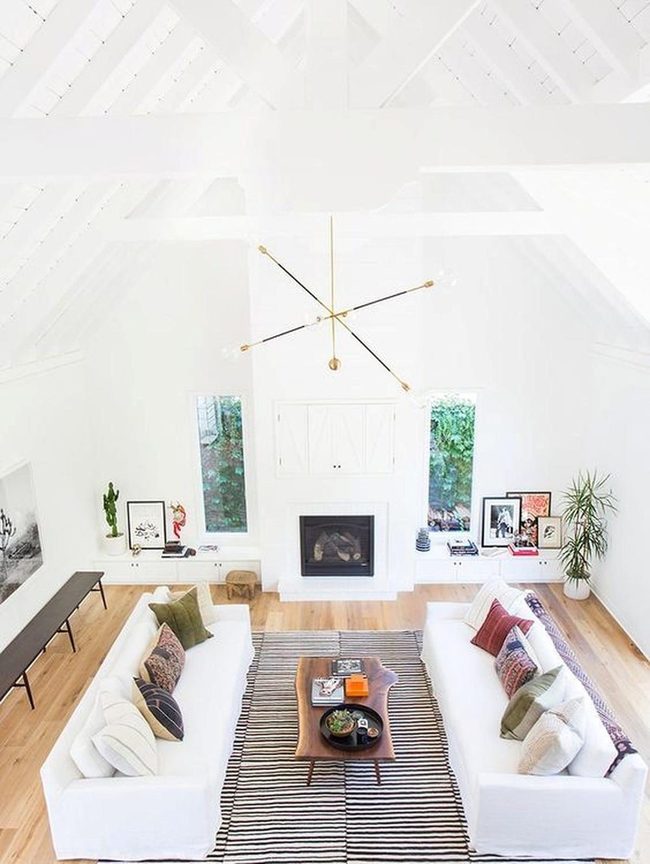 White Soaring Ceilings And Modern Chandelier
