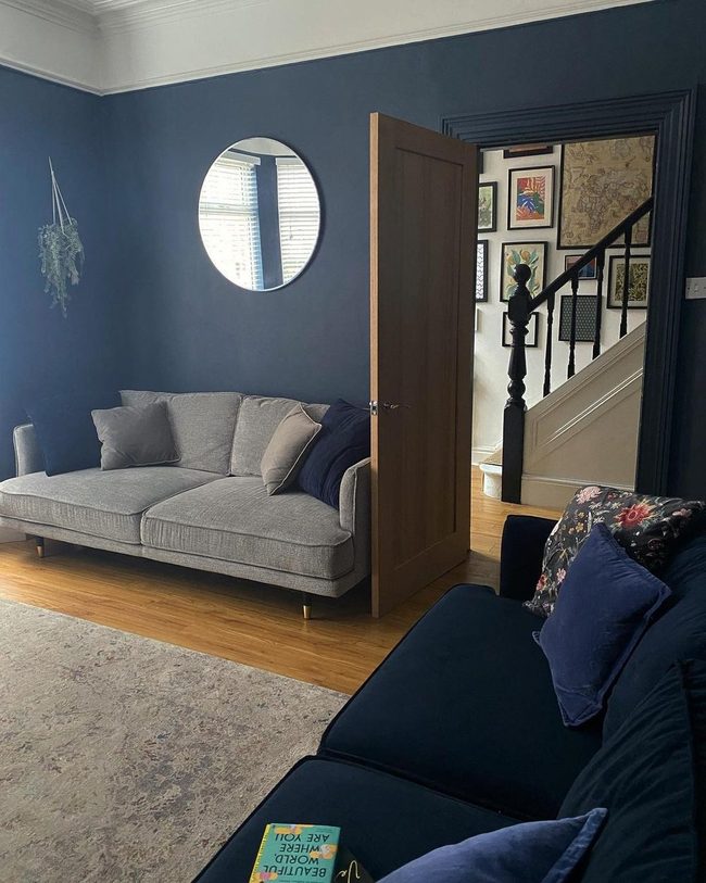 Navy Walls Gray Sofas Sophistication