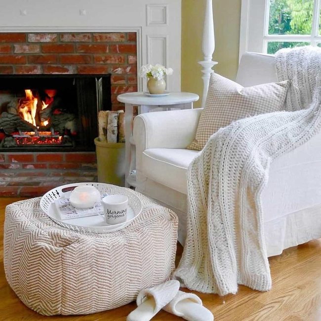 Cream Pouf With Fireplace Corner