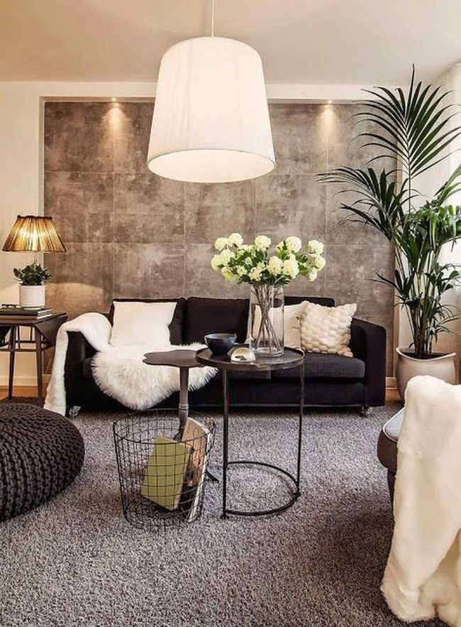 Black Sofa Against Gray Textured Wall