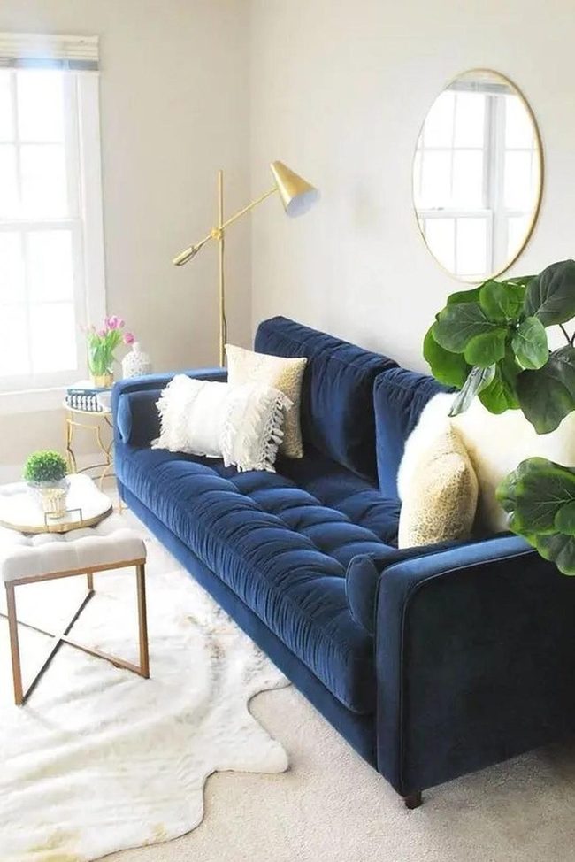 Deep Blue Sofa With Golden Accents