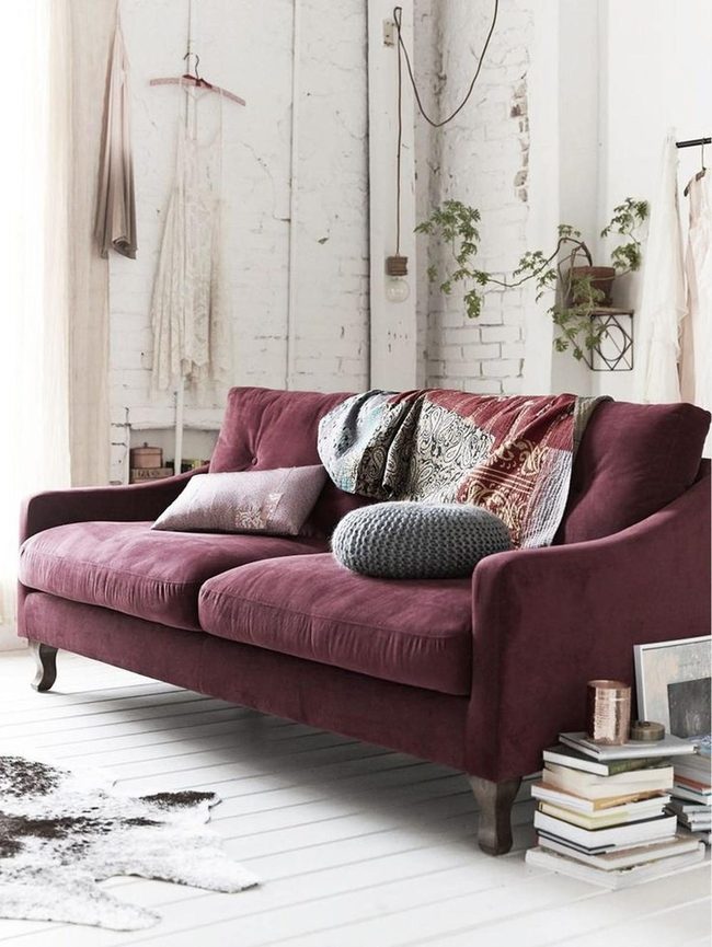 Burgundy Sofa Bathed In Brick Light