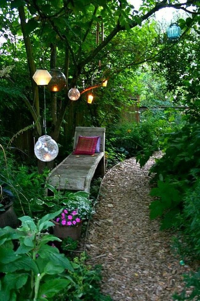 Wooden Bench Among Blooming Garden Paths