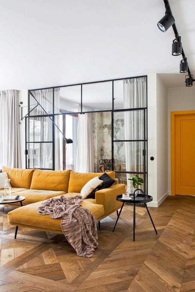 Mustard Sofa Against Herringbone Wood
