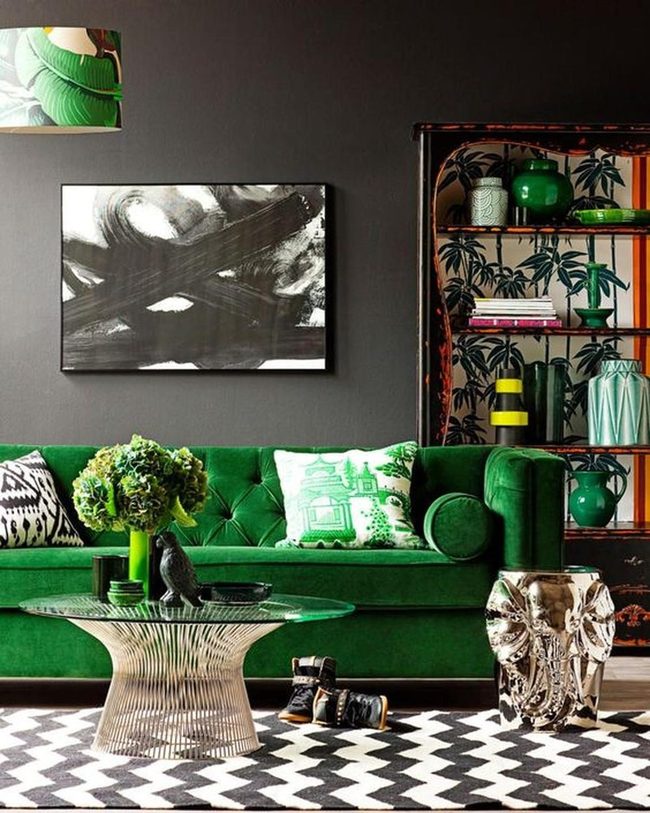 Green Sofas Against Dramatic Black Walls