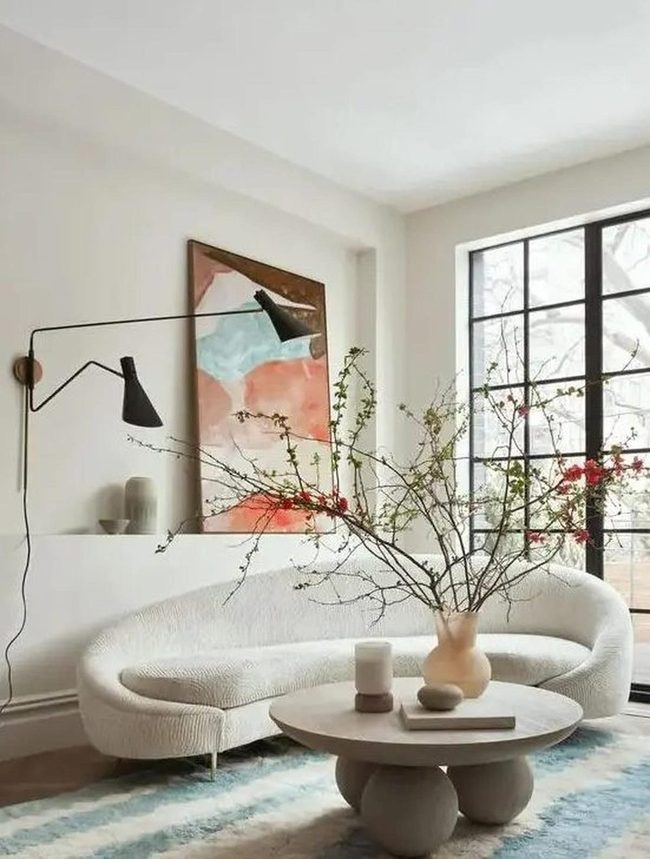 Curved White Sofas, Bold Abstract Art