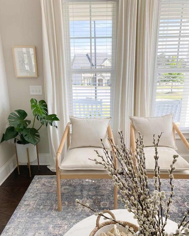 Beige Chairs With Natural Branches And Blue Rug