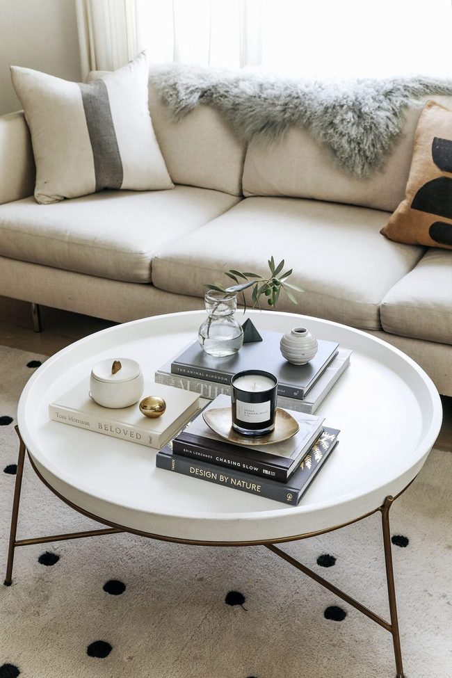 Layered Coffee Table With Books And Green
