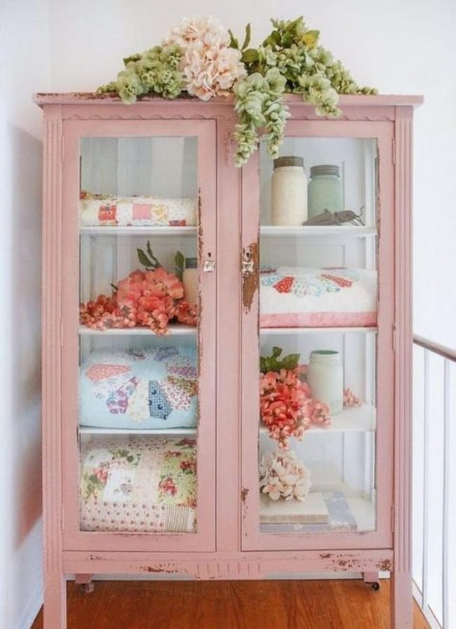 Pink Cabinet With Quilted Fabric Display