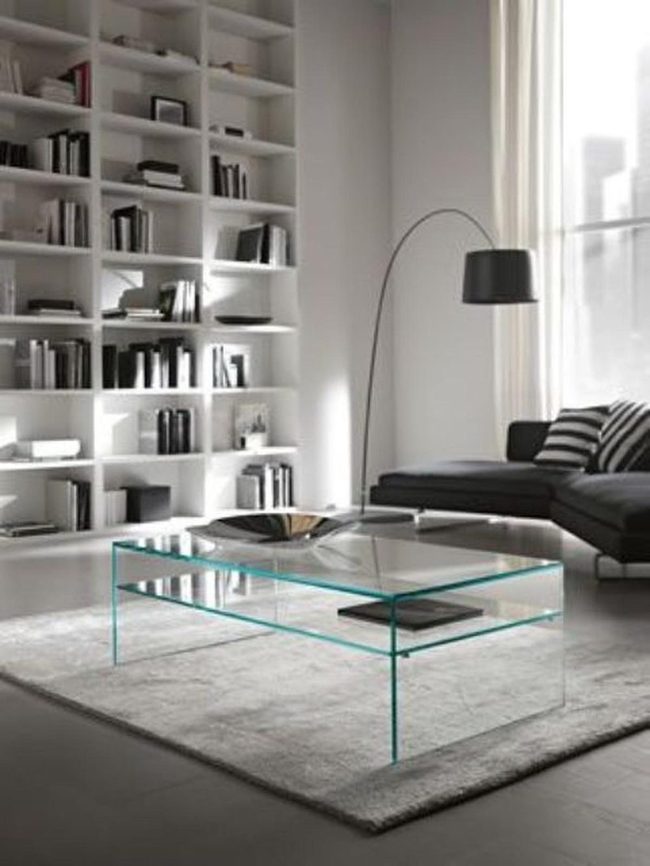 Colorful Books Wall With Dark Sofa