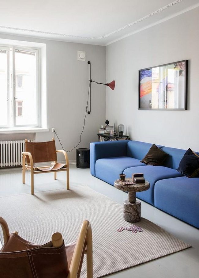 Gray Walls, Blue Sofa, Red Lamps