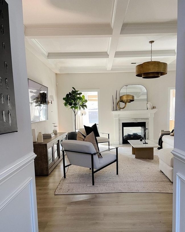 Circular Mirror Above Fireplace