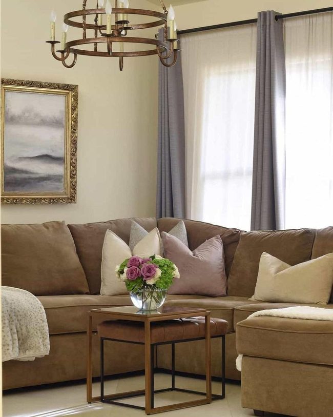 Bronze Chandeliers Above Brown Sectional