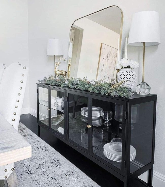 Black Glass Sideboard With Natural Greenery
