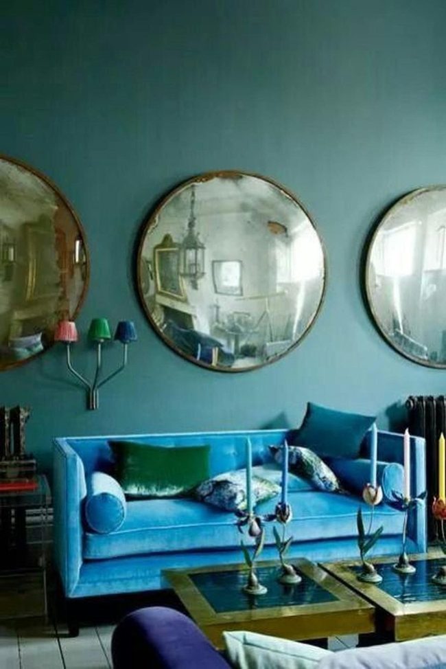 Blue Sofa With Circular Mirrors