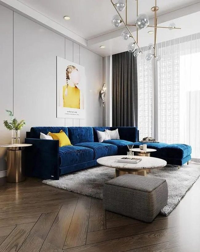 Blue Sectional With Marble And Gold Accents