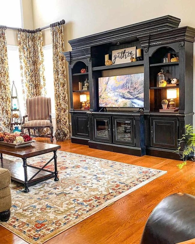 Black Tv Center With Warm Wood Details