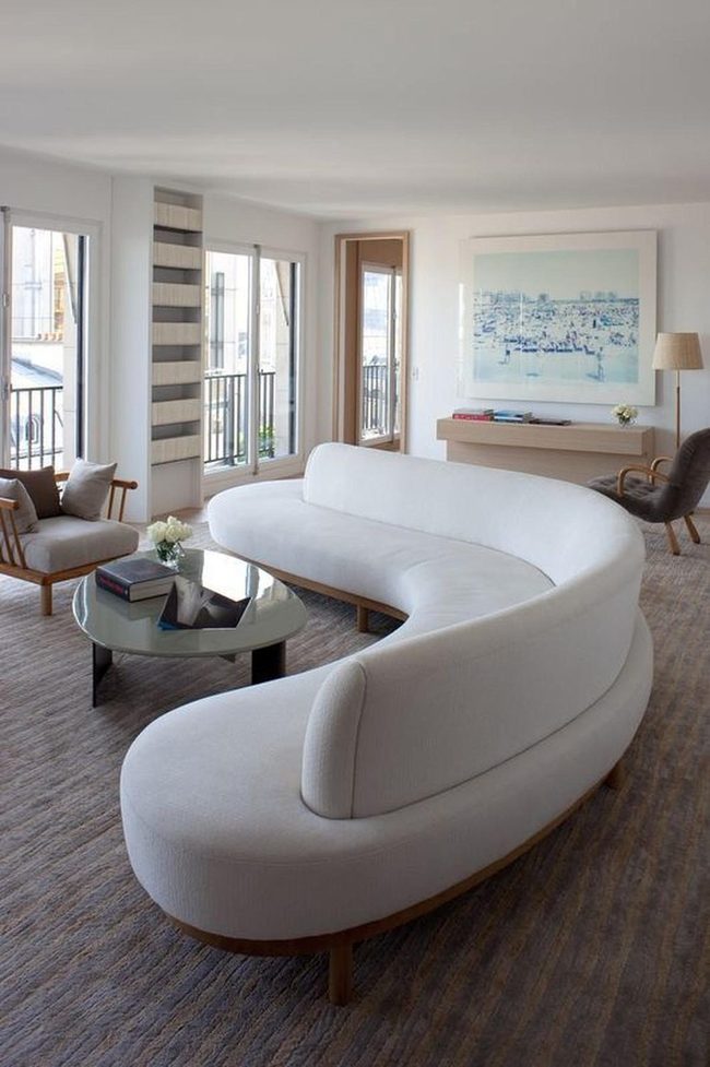Curved White Sofa Flooded Light