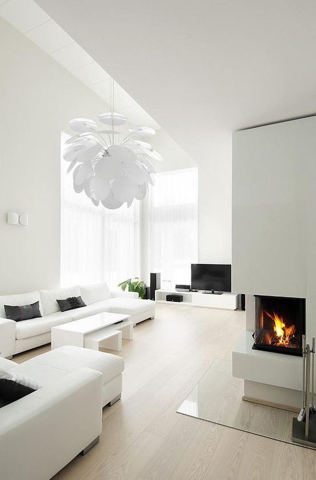 Sunlit White Living Room With Fireplace