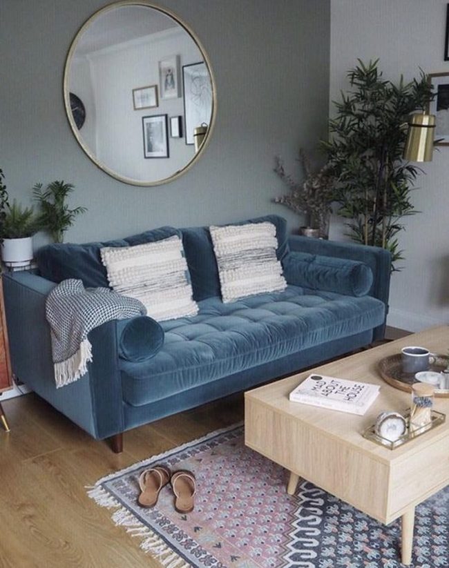Deep Blue Sofas And Round Mirrors
