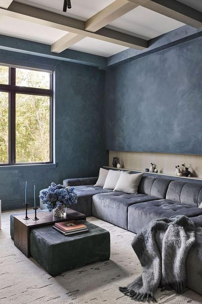 Blue Walls, Gray Sofa, Wood Beams