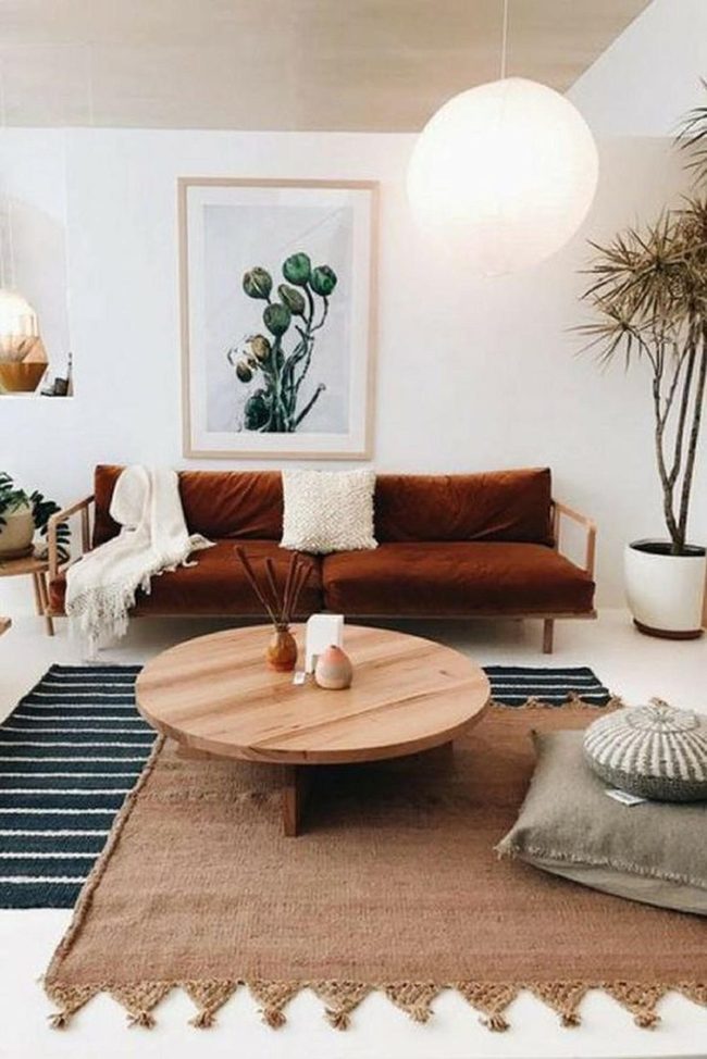 Brown Leather Couch With Natural Plants