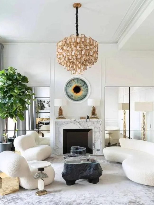 Eye-Shaped Art Above Marble Fireplace