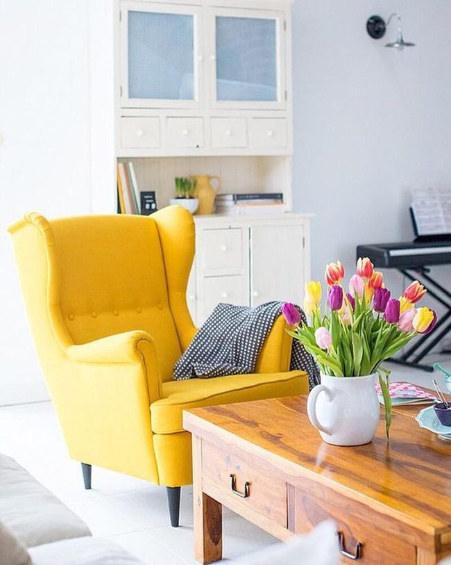 Yellow Seating, Wooden Warmth, Blooming Accents