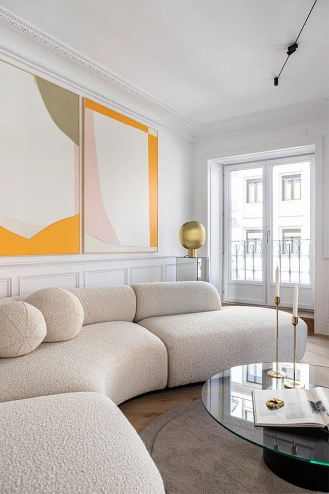 Orange Abstract Art Above Cream Sofa