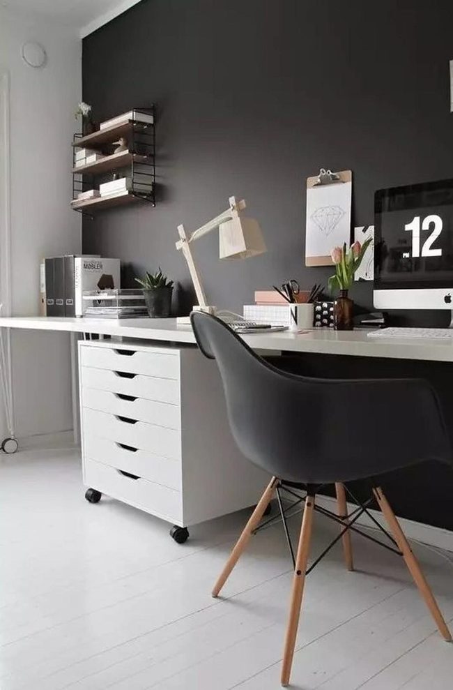 White Desk Against Dark Wall
