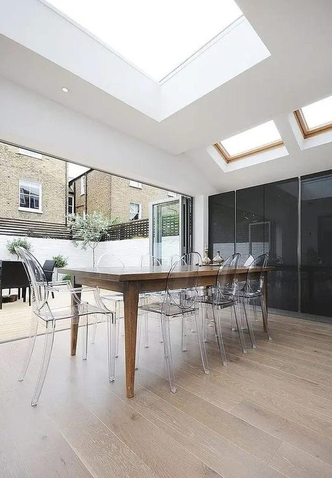 Skylit Wooden Dining With Green Views