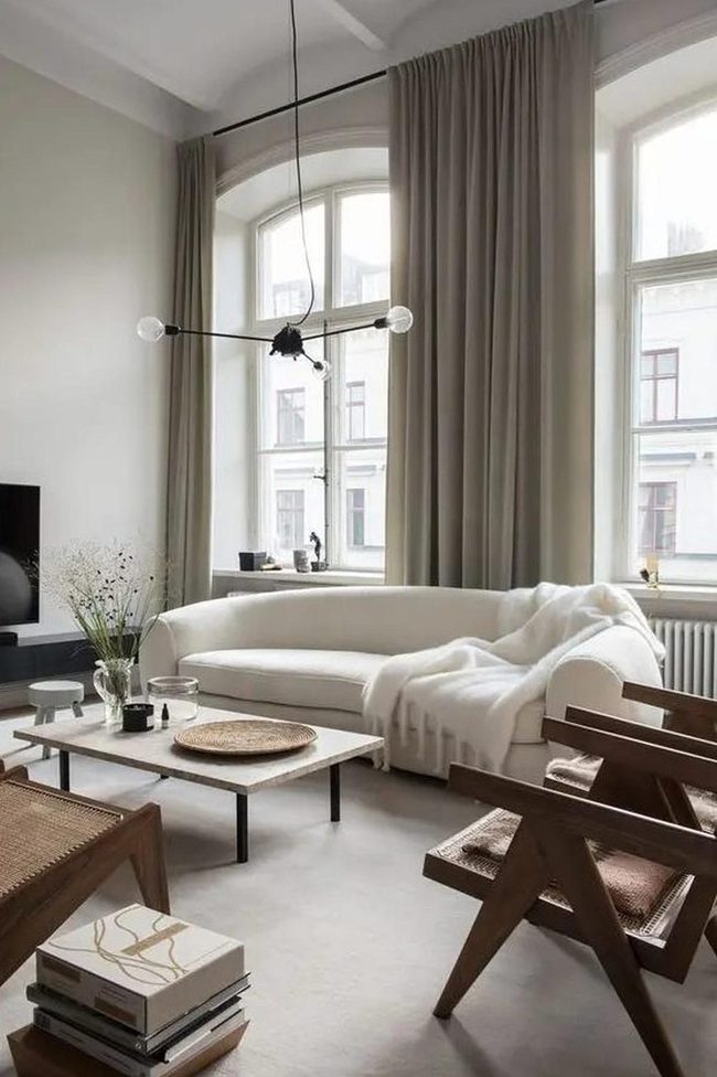 Curved White Sofa Catches Sunlight