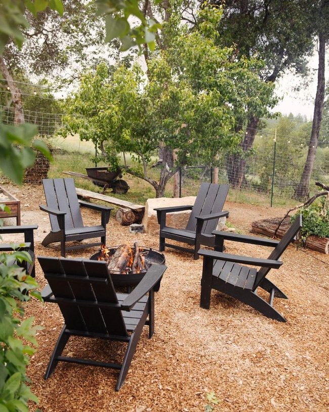 Black Chairs, Green Countryside Retreat