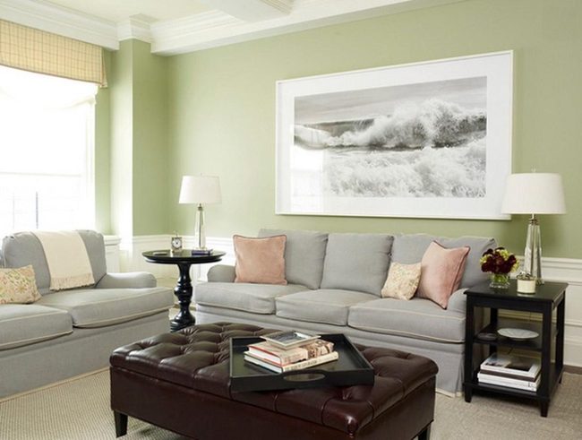 Green Walls With Coastal Artwork And Soft Pastels