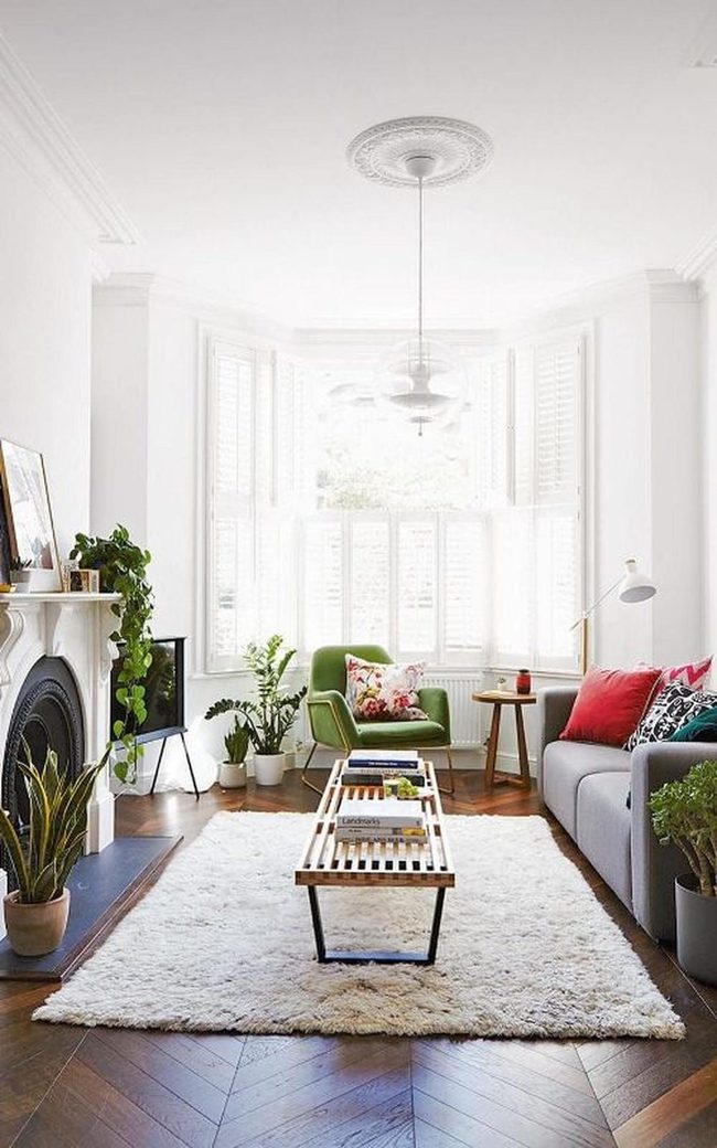 White Walls, Gray Sofa, Red Accents