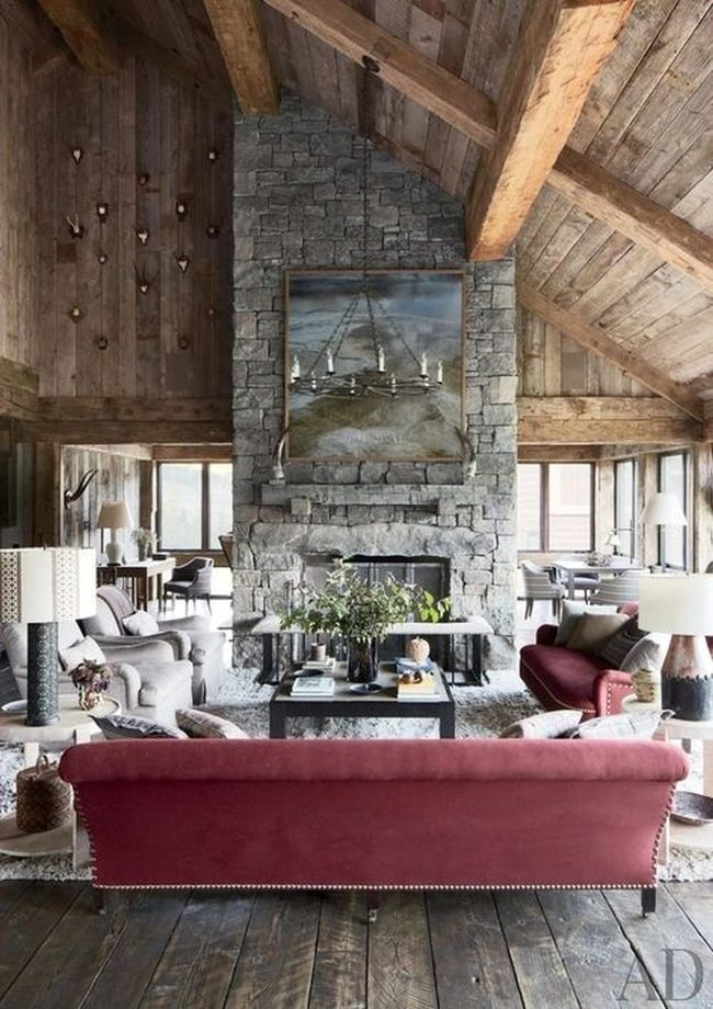 Stone Fireplace Meets Deep Red Comfort