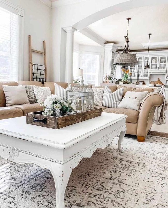 Distressed White Coffee Table Anchors Tan Leather Living