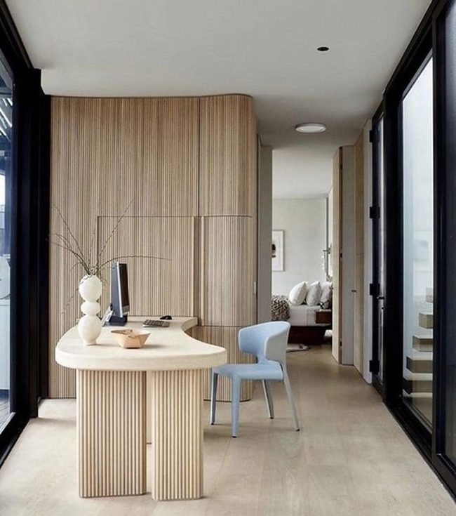 Curved Desk Meets Wood Panels