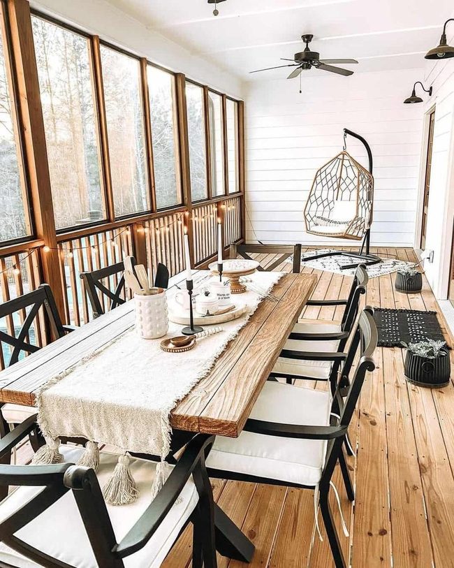 White Shiplap Porch Dining Space