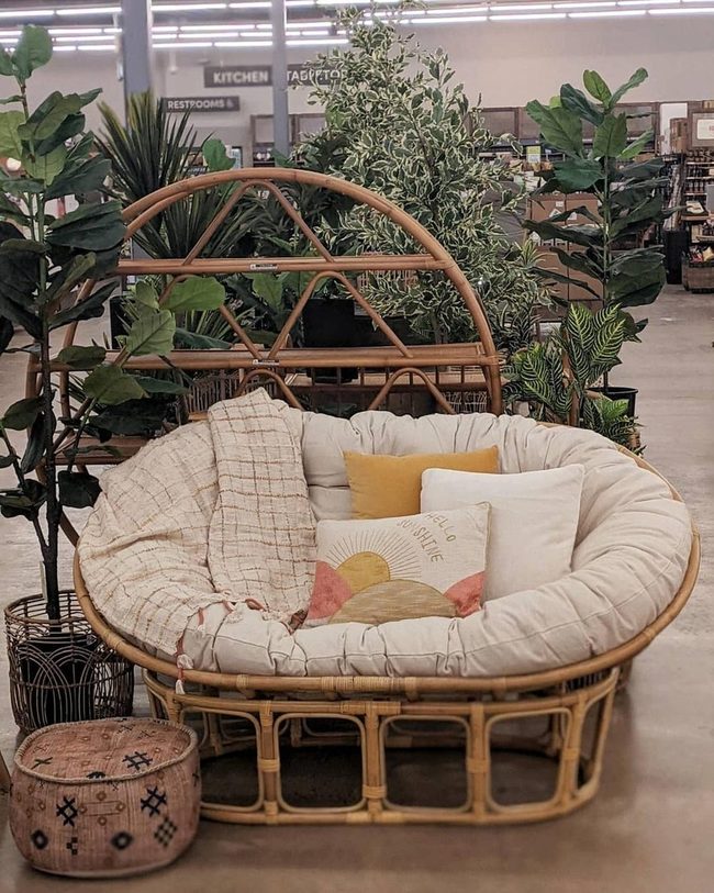 Woven Chair Nestled In Greenery