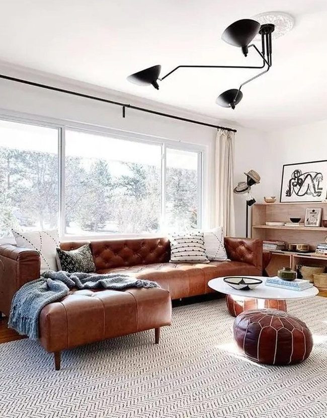 Brown Leather Sofa Dominates Light-Filled Room