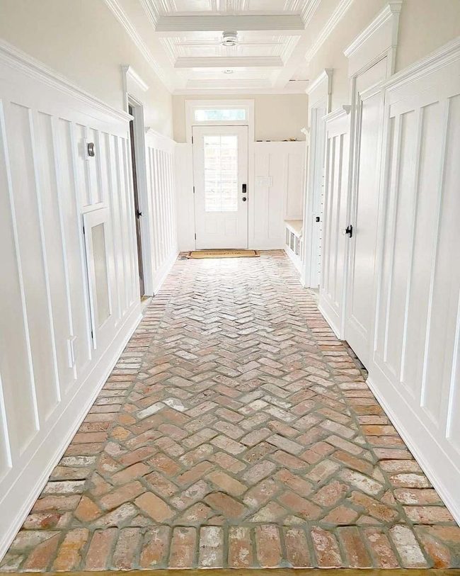 Herringbone Brick Hallway With White Door