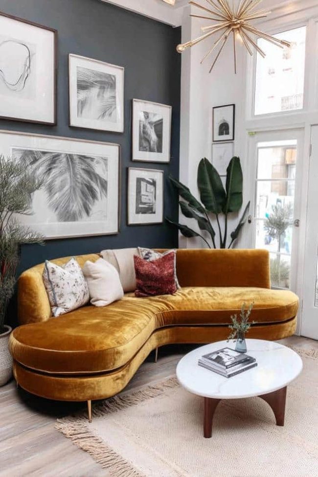 Gold Velvet Sofa Against Charcoal Wall