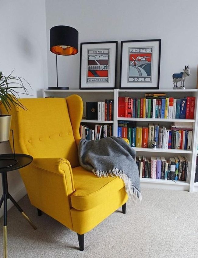 Sunny Yellow Chair Among Colorful Books