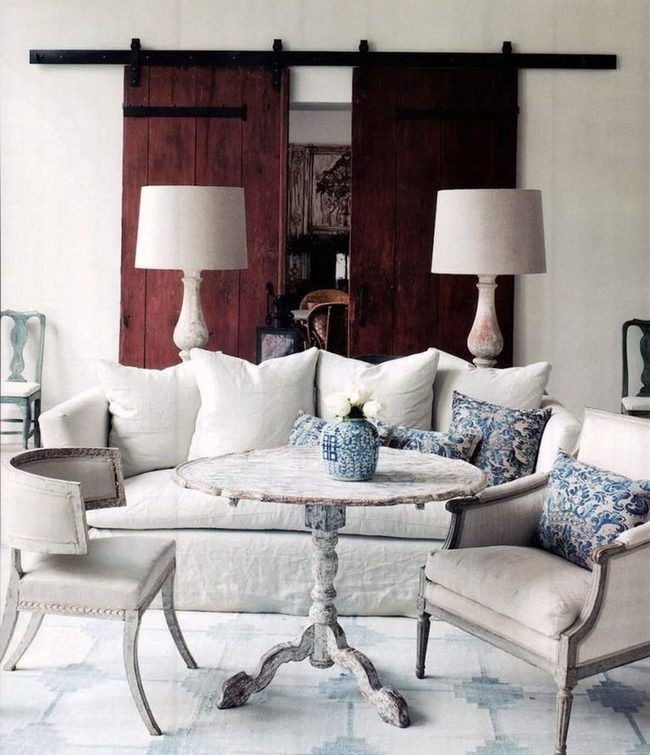 Round Wood Table, White Pillows, Blue Accents