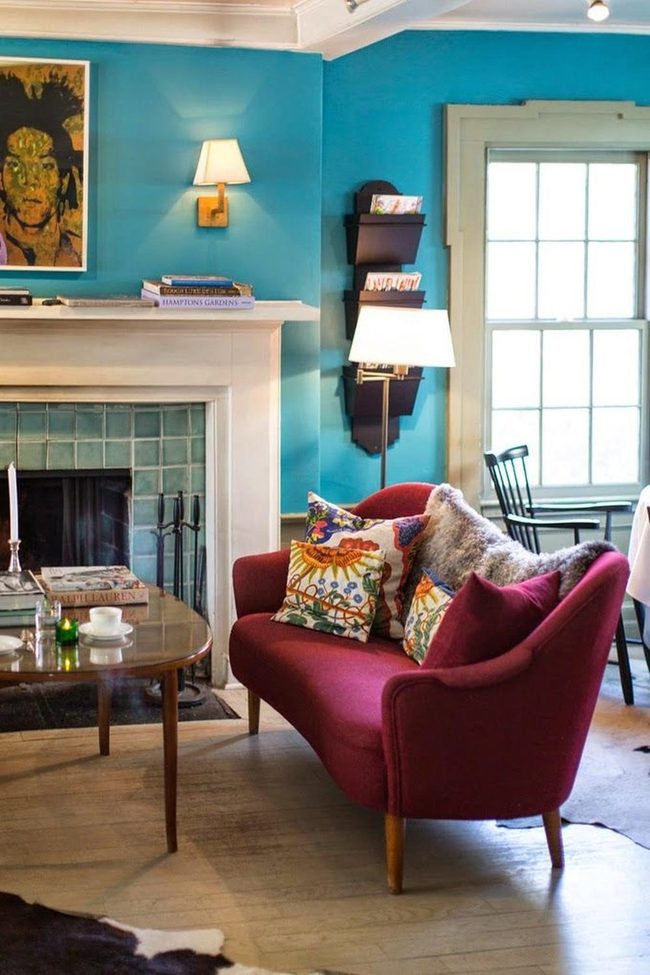 Red Couch Against Blue Walls