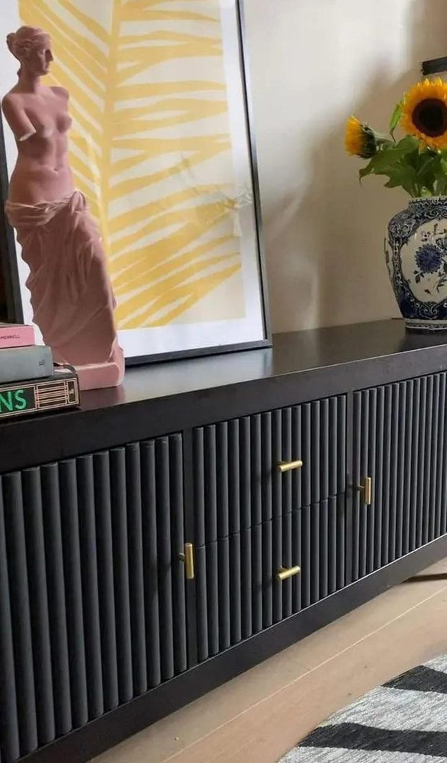 Black Cabinet Gold Accents Pink Sculpture